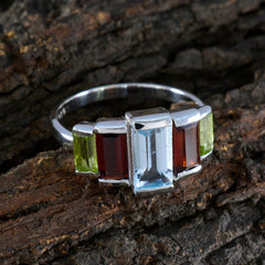 Camila boho multicolor gemstone ring with green, red, and blue stones set in silver band