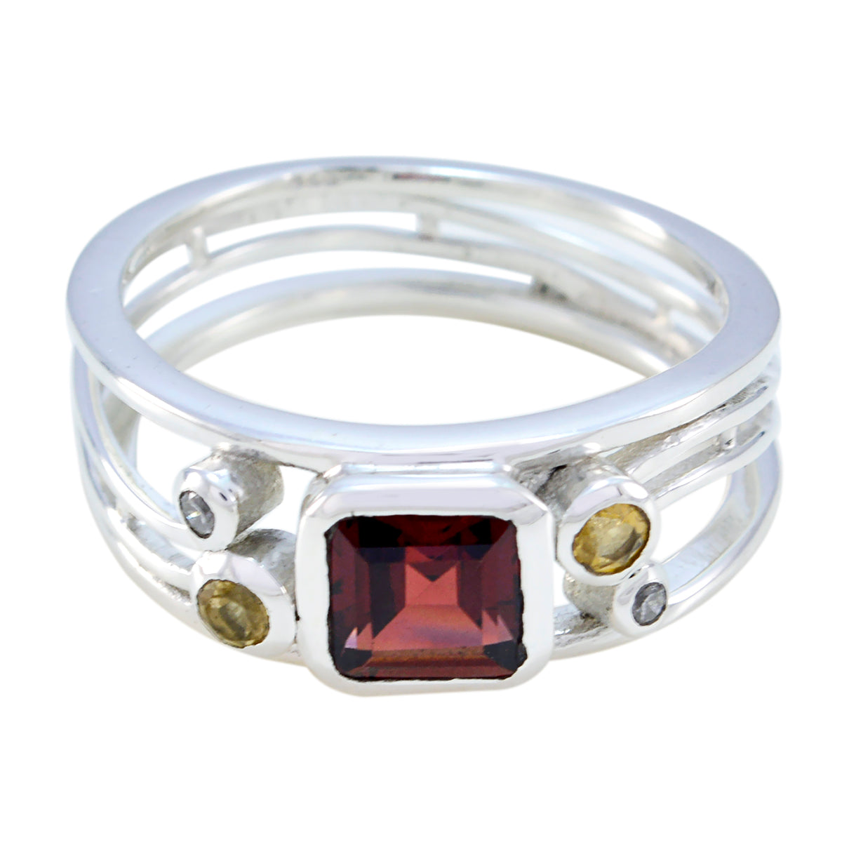 Boho multicolor gemstone ring by María featuring a square red center stone with smaller round stones on a silver band