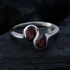 Hina boho red gemstone ring featuring two teardrop red gemstones set in silver band