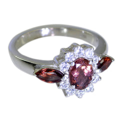 Andrea boho red gemstone ring silver band with oval red center halo of clear stones and marquise side gems