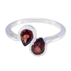 Hina boho red gemstone ring with two teardrop-shaped red stones set in silver band
