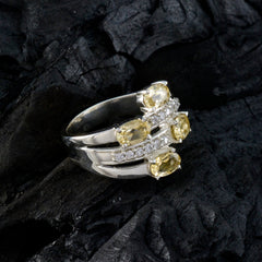 Boho yellow gemstone ring by Yasmine with silver band and multiple yellow stones set in an elegant design