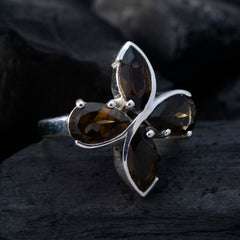 Savannah brown gemstone floral ring with silver band and four marquise-cut brown stones arranged in a flower pattern