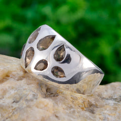 Isabel brown navratna ring with teardrop shaped brown stones set in polished silver band