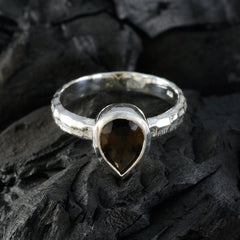 Saanvi brown solitaire ring with pear-shaped brown gemstone set in textured silver band