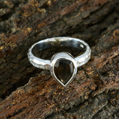 Saanvi brown solitaire ring with teardrop-shaped brown gemstone on textured silver band