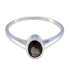 Naomi brown solitaire ring with oval brown gemstone set in polished silver band