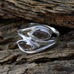 Natalia brown toi et moi ring with two marquise brown gemstones in twisted sterling silver band on rustic wood