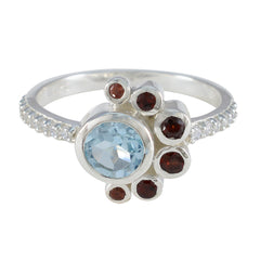 Silver Ling ring with light blue aquamarine center and garnet accents on pave diamond band colorful party wear fashion ring