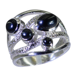 Pilar contemporary black gemstone ring with multiple round black stones set in textured silver band