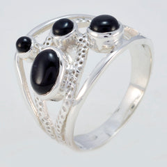 Pilar contemporary black gemstone ring with four oval and round black stones set in textured silver band