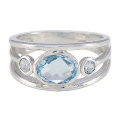 Teresa contemporary blue gemstone ring with three blue stones set in silver band