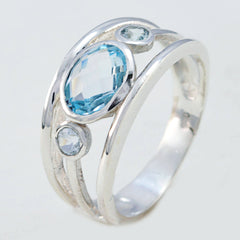 Teresa contemporary blue gemstone ring with three blue stones in a silver band