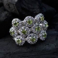 Tereza contemporary green gemstone ring featuring multiple green stones and intricate silver detailing