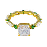 contemporary green gemstone ring by Hye jin gold band with square clear center stone and small green accents