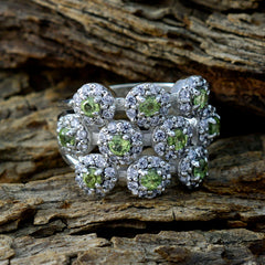Tereza contemporary green gemstone ring with multiple green stones surrounded by diamonds on silver band