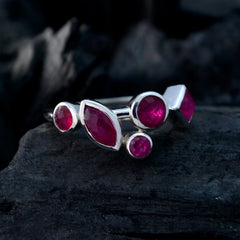 Kennedy contemporary red gemstone ring with multiple red stones set in silver on dark background