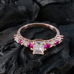 Teresa rose gold ring with emerald cut center stone and accent rubies and diamonds contemporary red gemstone ring