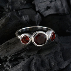 Yuki contemporary red gemstone ring with three red stones set in silver band