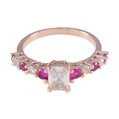 Teresa rose gold ring with emerald cut center stone and alternating rubies and diamonds contemporary red gemstone ring