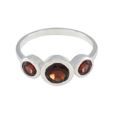 Yuki contemporary red gemstone ring with three round red stones set in a silver band