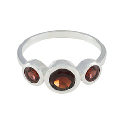 Yuki contemporary red gemstone ring with three round red stones set in a silver band