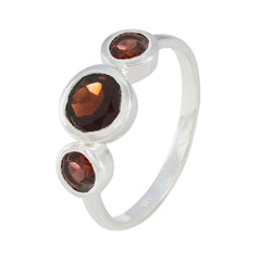 Yuki contemporary red gemstone ring featuring three round red gemstones set in silver band
