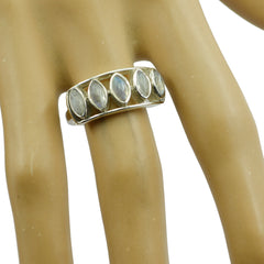 Araya contemporary white gemstone ring with multiple oval gemstones set in silver band on display finger