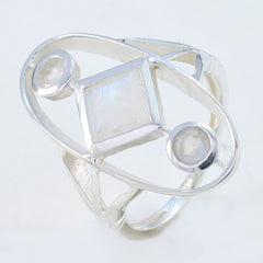 Lily silver ring with square moonstone center and two round moonstones in oval frame contemporary white trilogy ring