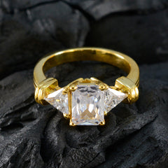 Daniela gold ring with three clear stones resembling a contemporary white trilogy ring design