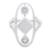 Lily contemporary white trilogy ring in sterling silver with three bezel moonstone settings and geometric design