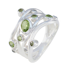 Nisa fairytale brown gemstone ring in sterling silver featuring multiple green peridot stones