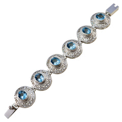 Alice Fashion Statement Bracelet with Blue Gem Accents