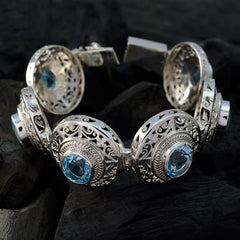 Alice Fashion Statement Bracelet with Blue Gem Accents