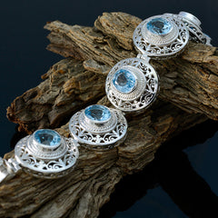 Alice Fashion Statement Bracelet with Blue Gem Accents