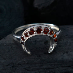 Isabelle feminine red gemstone ring featuring crescent design with multiple red stones set in silver band