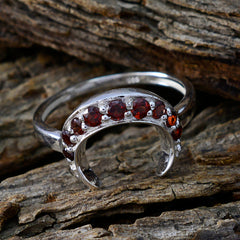 Isabelle feminine red gemstone ring with multiple red stones set in silver crescent design