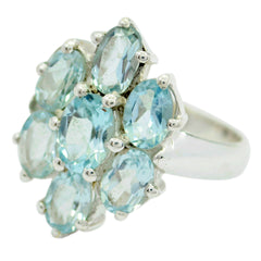 Siti floral gemstone ring for women with multiple light blue oval gemstones in a flower design