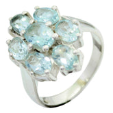 Siti floral gemstone ring for women with multiple light blue gemstones in a silver setting