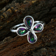 Yuki silver floral gemstone ring for women with multicolor teardrop stones on a rustic wood background