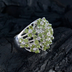 Florencia floral green gemstone ring with silver band and multiple small green and clear stones