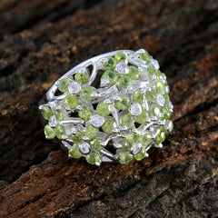 Florencia floral green gemstone ring with intricate silver setting and delicate green stones