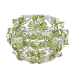 Florencia floral green gemstone ring with intricate silver setting and multiple green stones