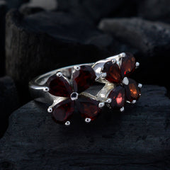 Natcha floral red gemstone ring with silver band featuring red flower-shaped gemstones