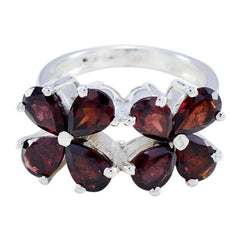 Natcha floral red gemstone ring with heart-shaped red stones set in silver band