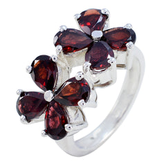 Natcha floral red gemstone ring with silver band featuring deep red petals in flower design