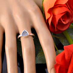 Putri geometric blue solitaire ring with triangular blue gemstone on silver band displayed on hand