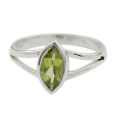 Mei geometric green solitaire ring with marquise-cut green gemstone and silver band