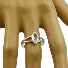 Camila geometric pink solitaire ring with marquise-cut stone on silver band worn on finger