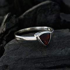 Emilia geometric red solitaire ring with a triangular red gemstone set on a silver band